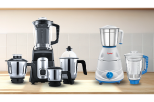 Various Prestige mixer grinders on a kitchen counter
